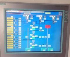 Extraction system for end plates at 11 slicers with cradle and conveyor