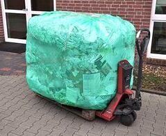 Round bale compacting system